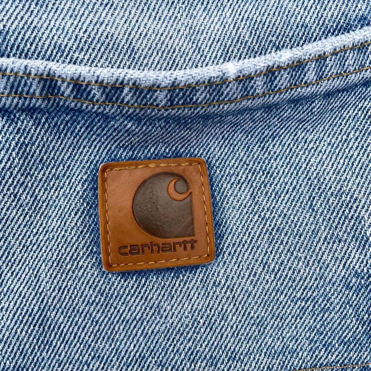 Vintage Carhartt light wash carpenter jeans