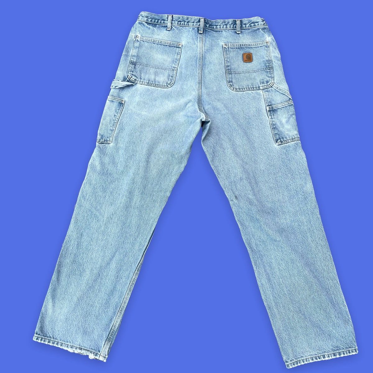 Vintage Carhartt light wash carpenter jeans