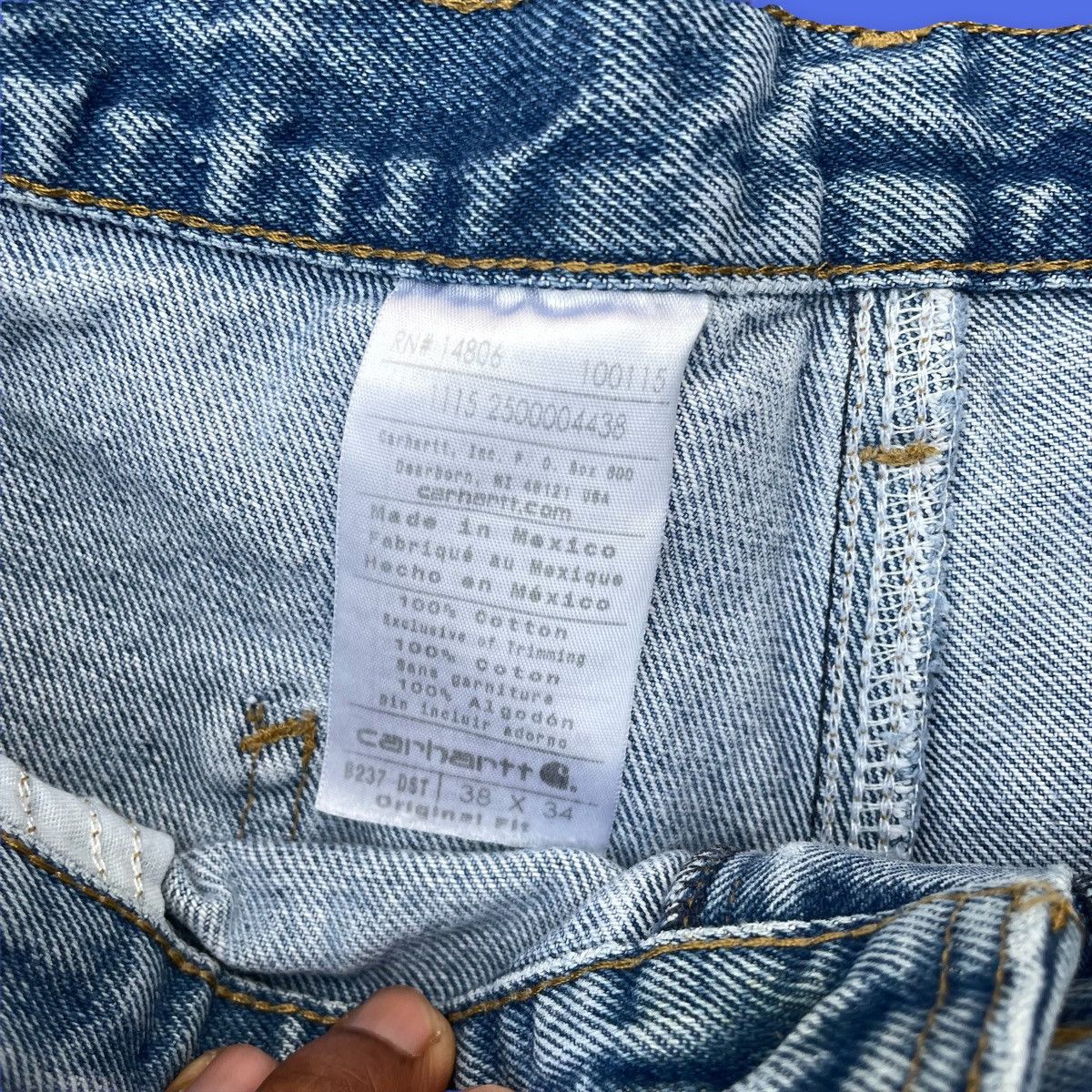 Vintage Carhartt light wash carpenter jeans