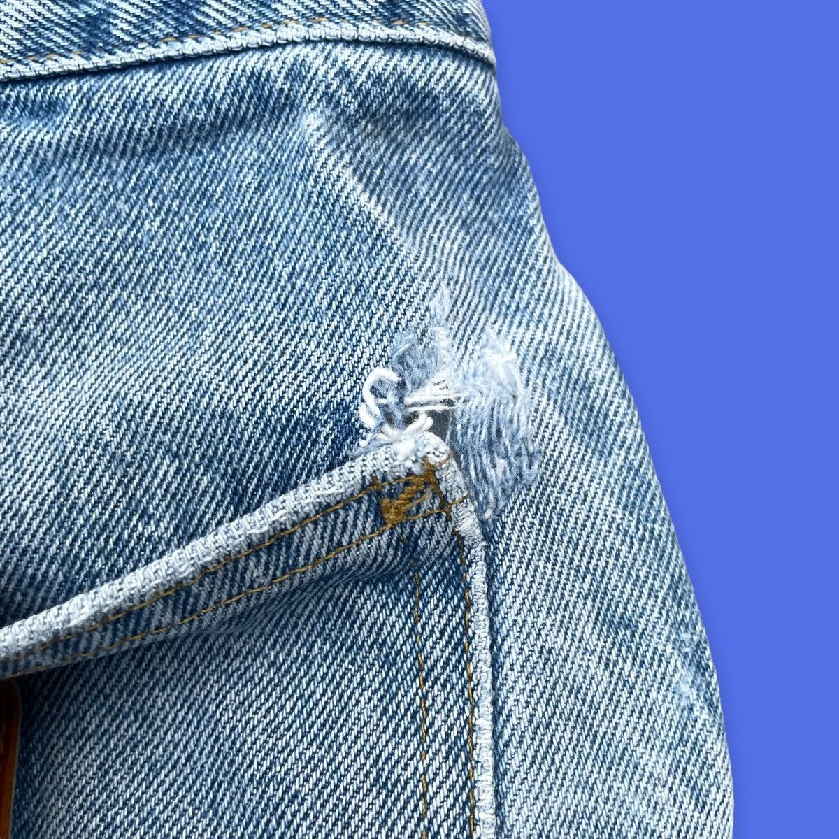 Vintage Carhartt light wash carpenter jeans