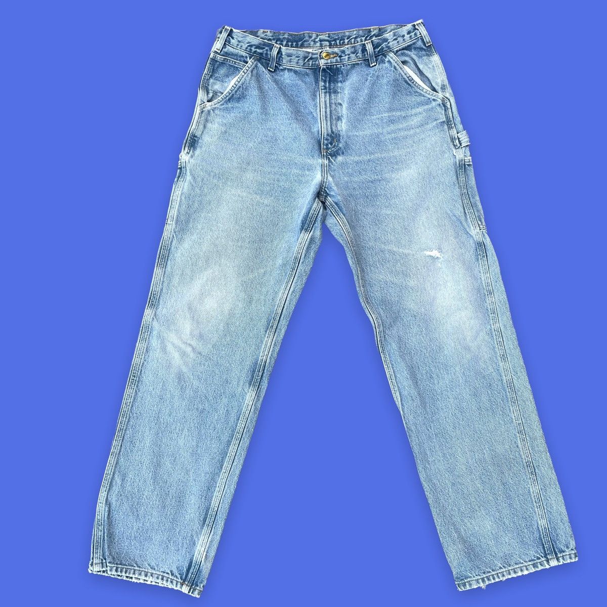 Vintage Carhartt light wash carpenter jeans