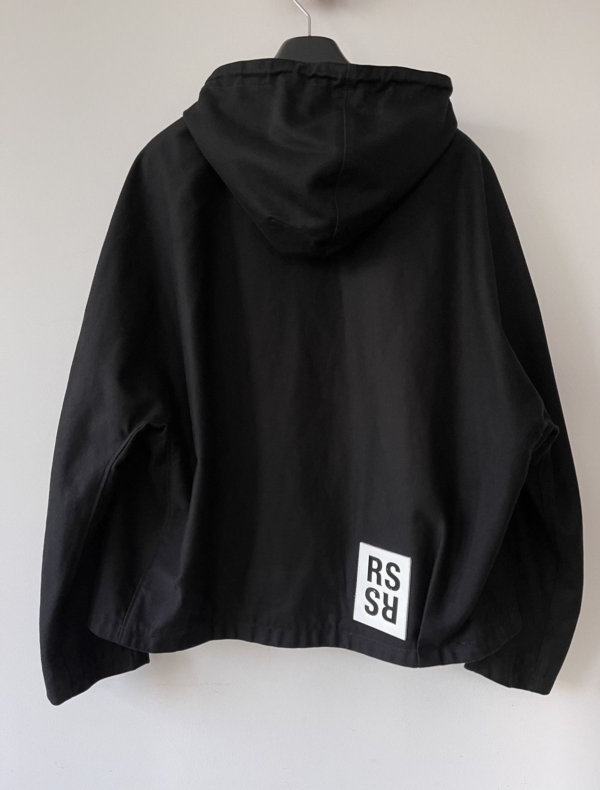 Raf Simons Black short hooded jacket with patch | Grailed