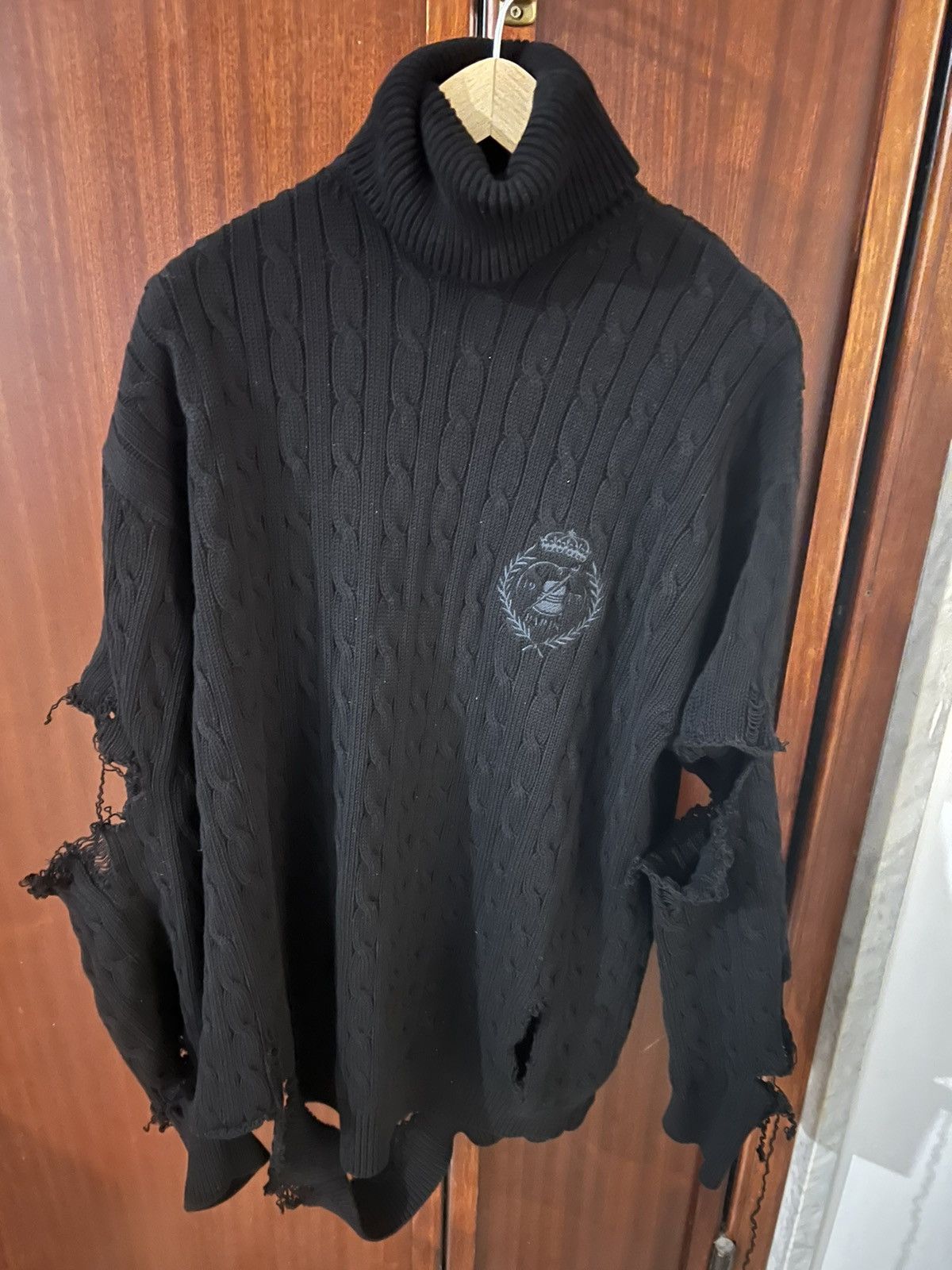 image of Balenciaga Crest-Logo Distressed Cable-Knit Cotton Sweater in Black, Men's (Size Large)