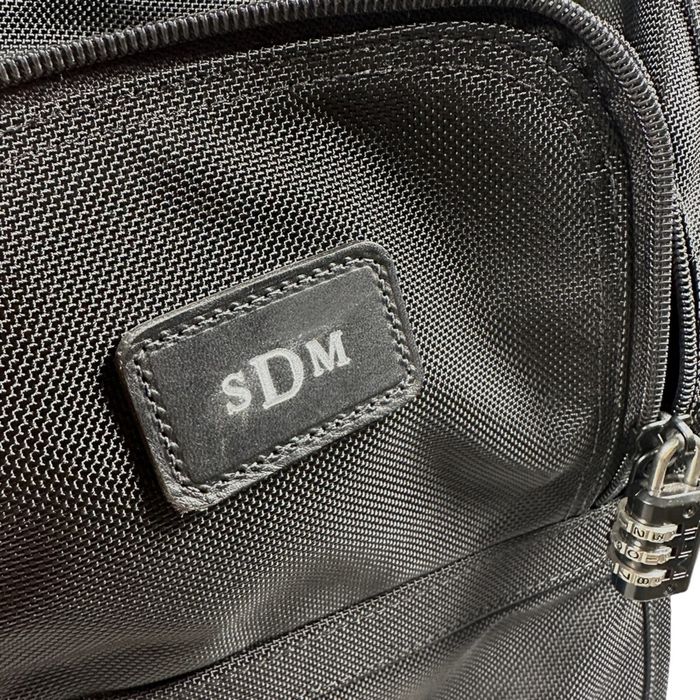 tumi backpack on wheels