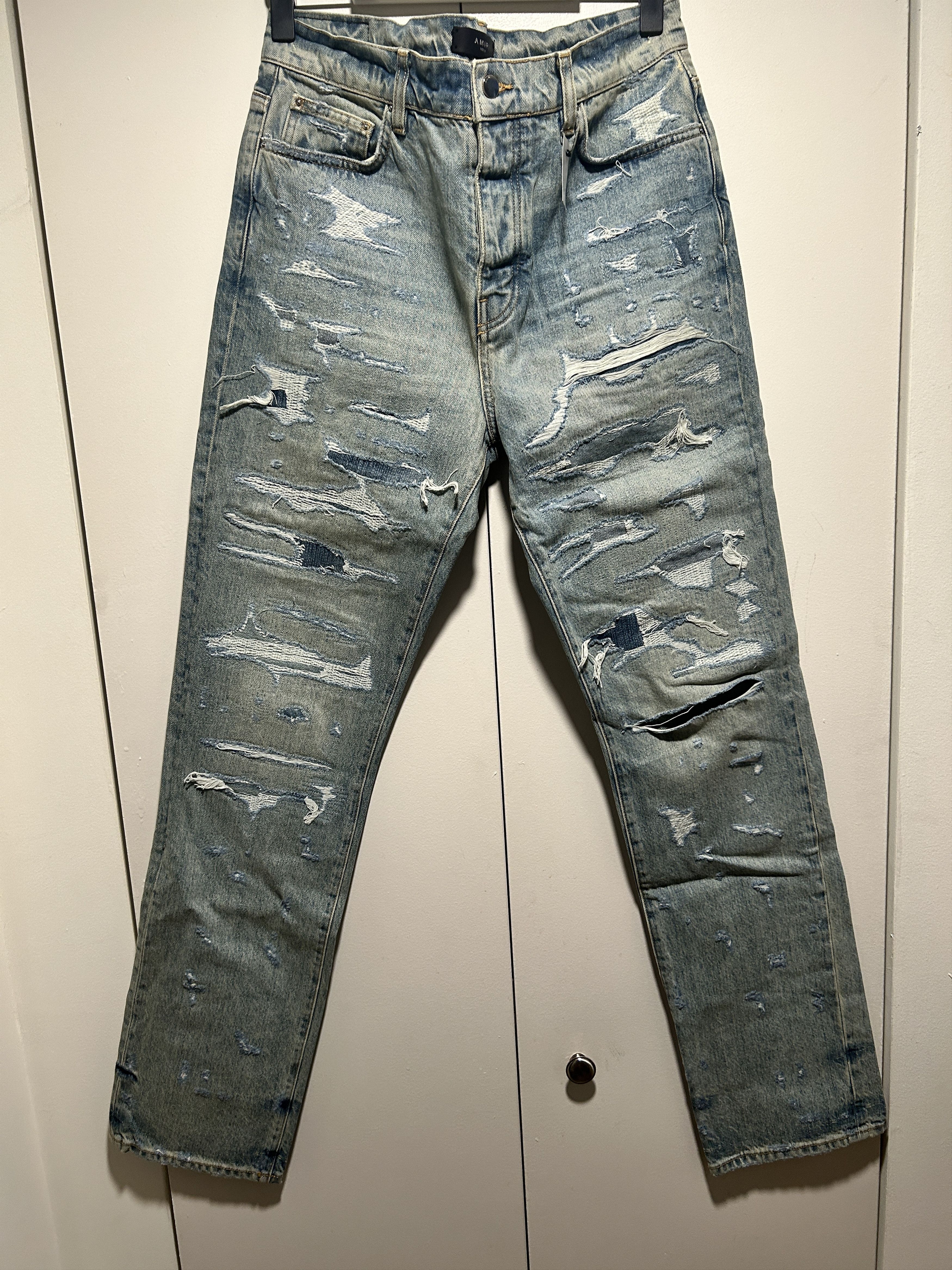 Amiri bruised relaxed jeans distressed