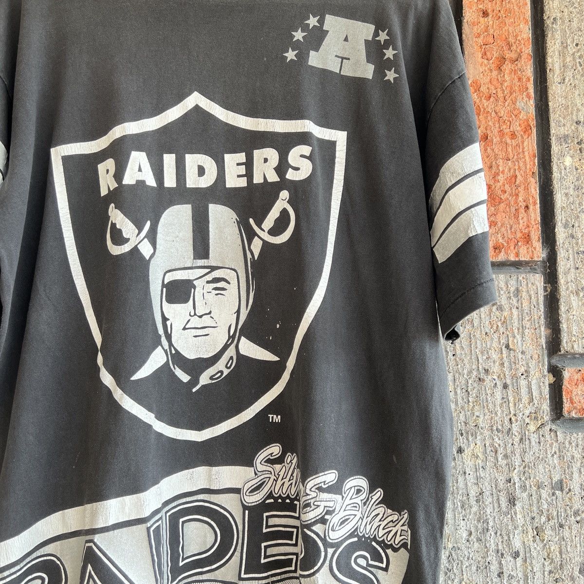 image of Oakland Raiders x Salem Vintage VTG 1994 Raiders All Over Print Tee Shirt Silver & Black (Size XL)