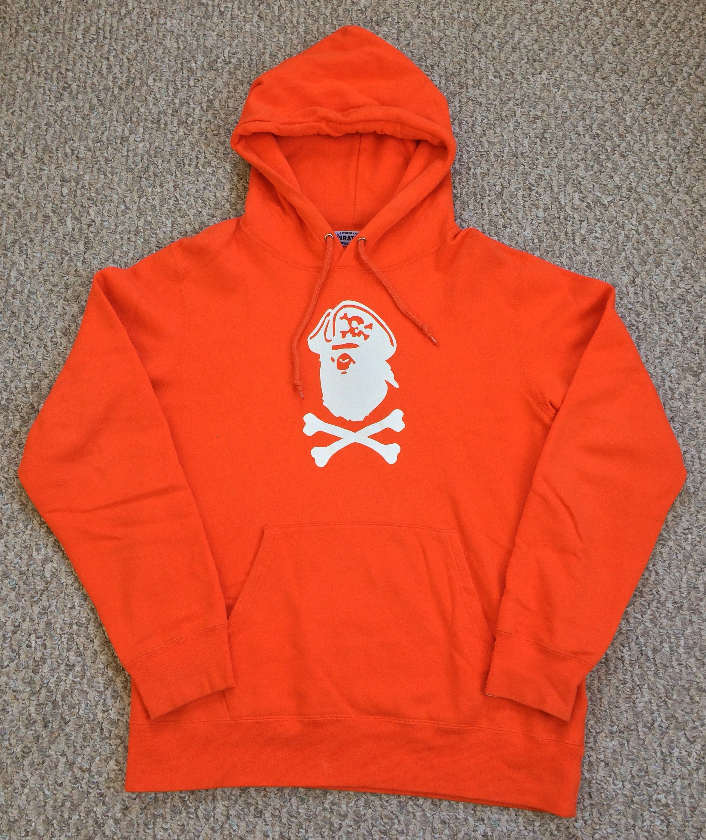 image of Bape Pirate Store Logo Hoodie in Orange, Men's (Size XL)
