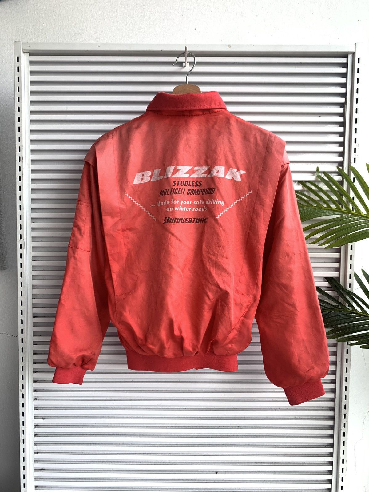 image of Racing x Sports Specialties Vintage Sunfaded Bridgestone Blizzak Bomber Light Jacket in Red (Size M