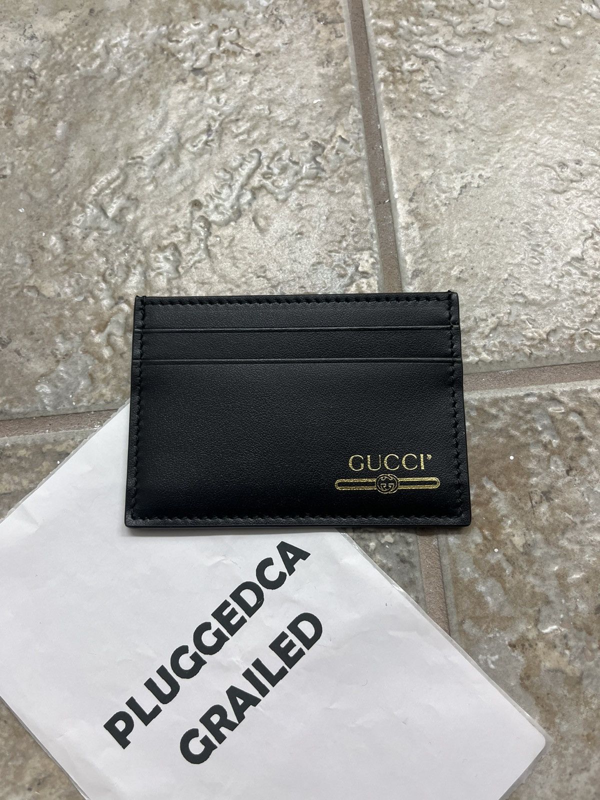 image of Gucci Gold Letters Card Holder in Black, Men's