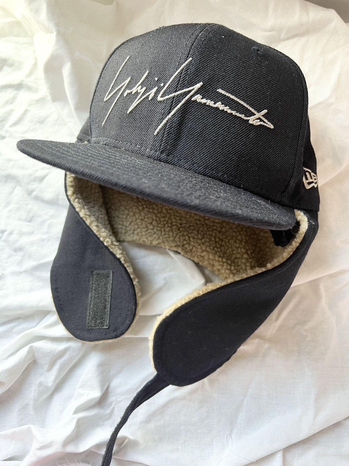 image of New Era Shearling Ear Flap Cap Hat in Black, Men's