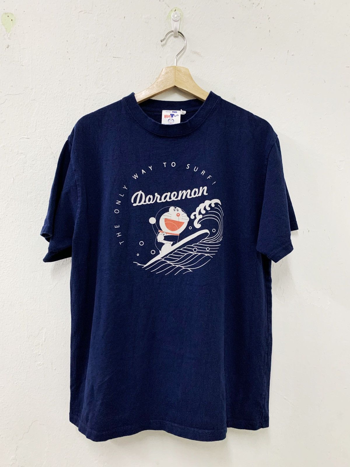 image of Anima Very Doraemon Suntory Surf Wave Graphic Japan in Dark Blue, Men's (Size Medium)