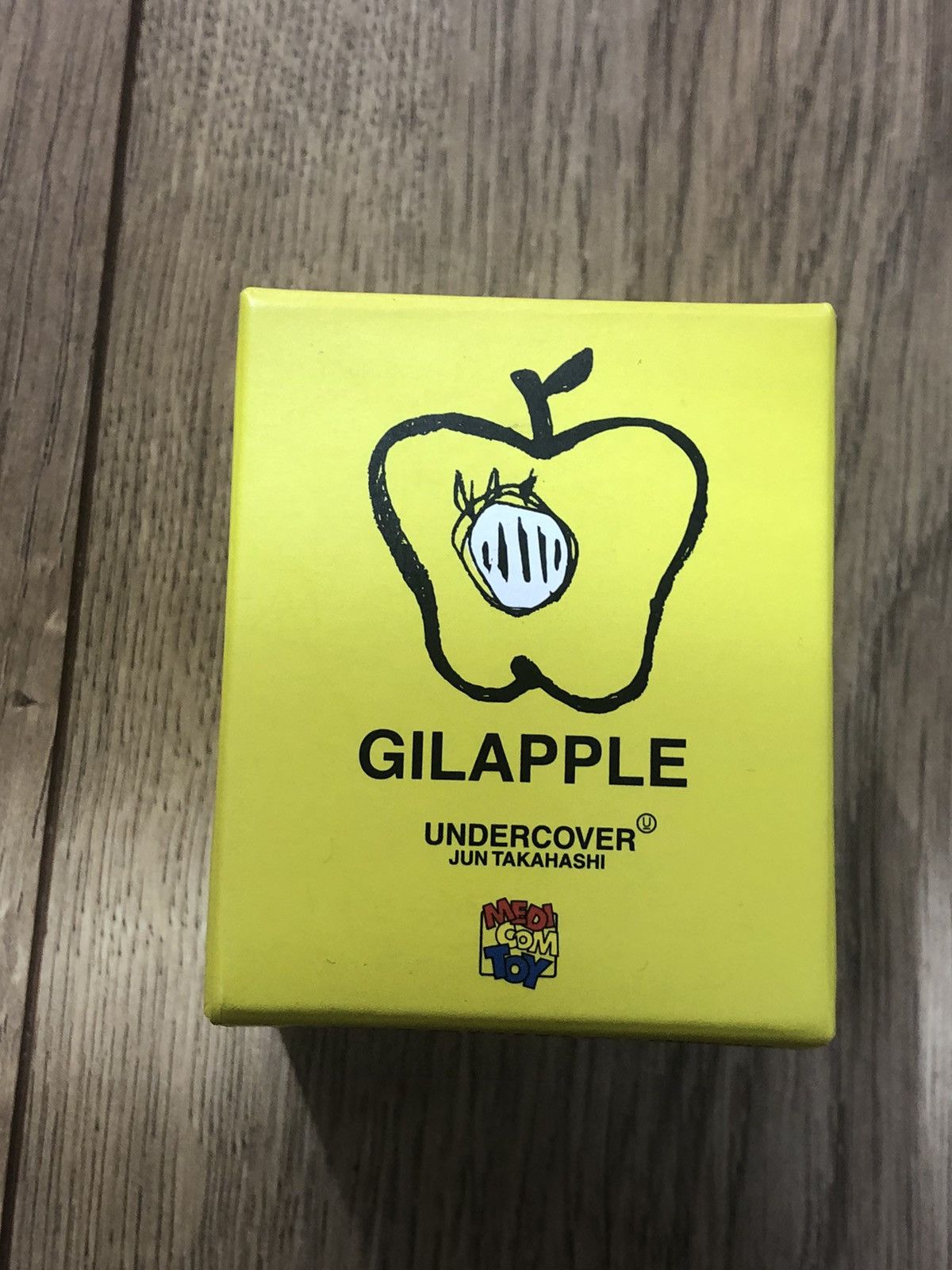 image of Undercover X Jun Takahashi Gilapple Keychain in Yellow, Men's