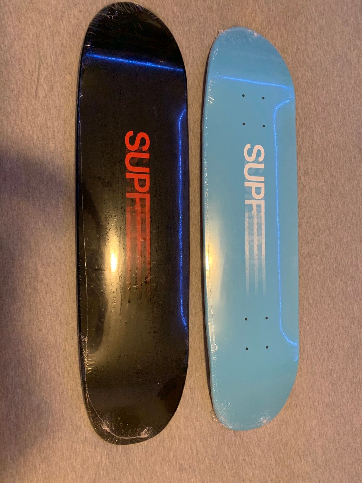 Supreme Supreme motion logo skateboards / set of 2   Grailed