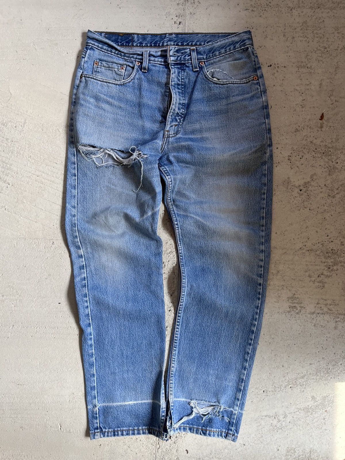 Vintage Levis blue wash distressed jeans
