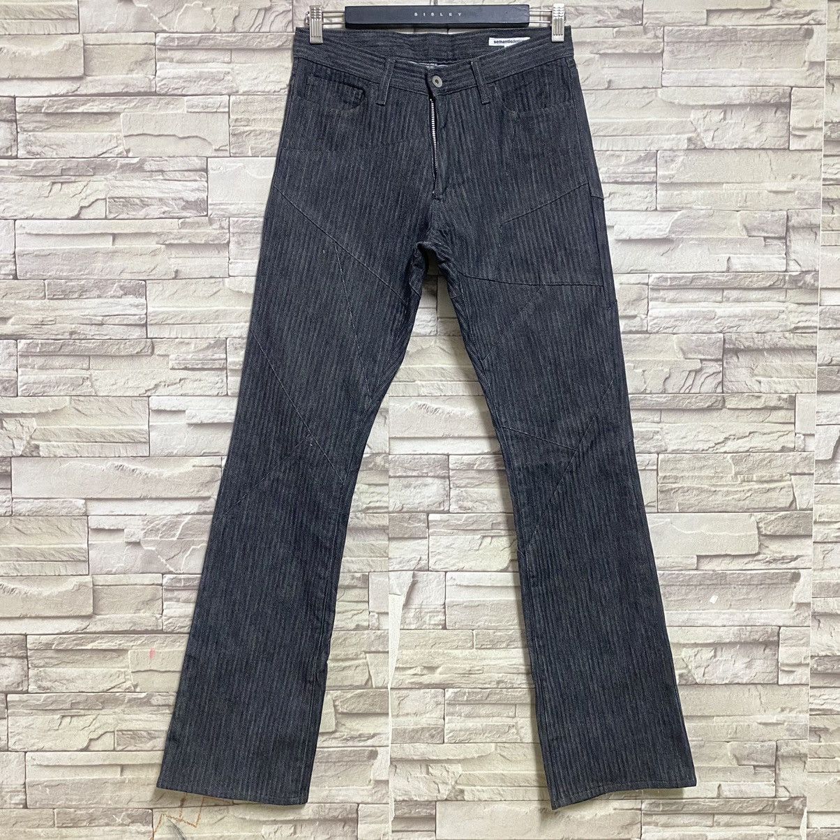SEMANTIC DESIGN Reconstructed Denim Flare Jeans