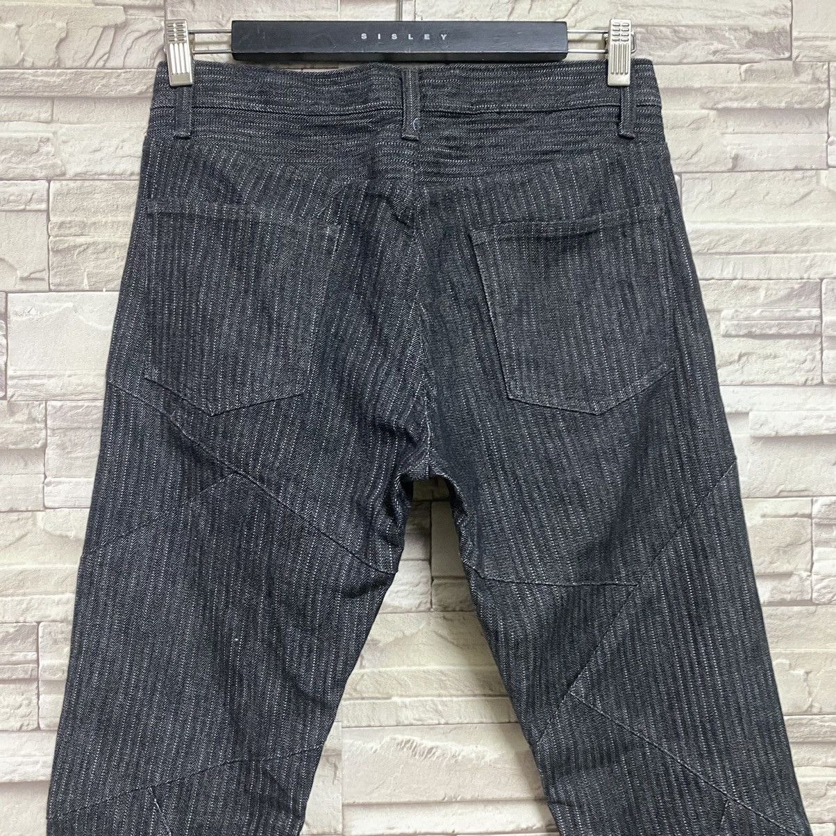 SEMANTIC DESIGN Reconstructed Denim Flare Jeans