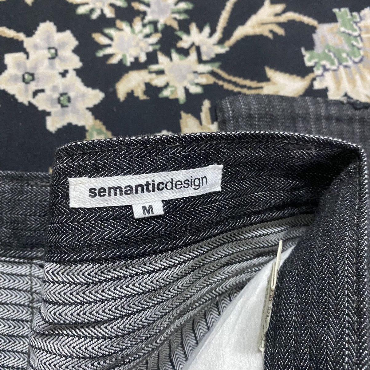 SEMANTIC DESIGN Reconstructed Denim Flare Jeans