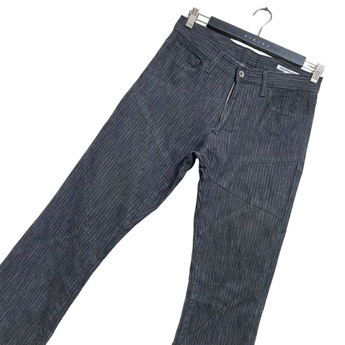 SEMANTIC DESIGN Reconstructed Denim Flare Jeans