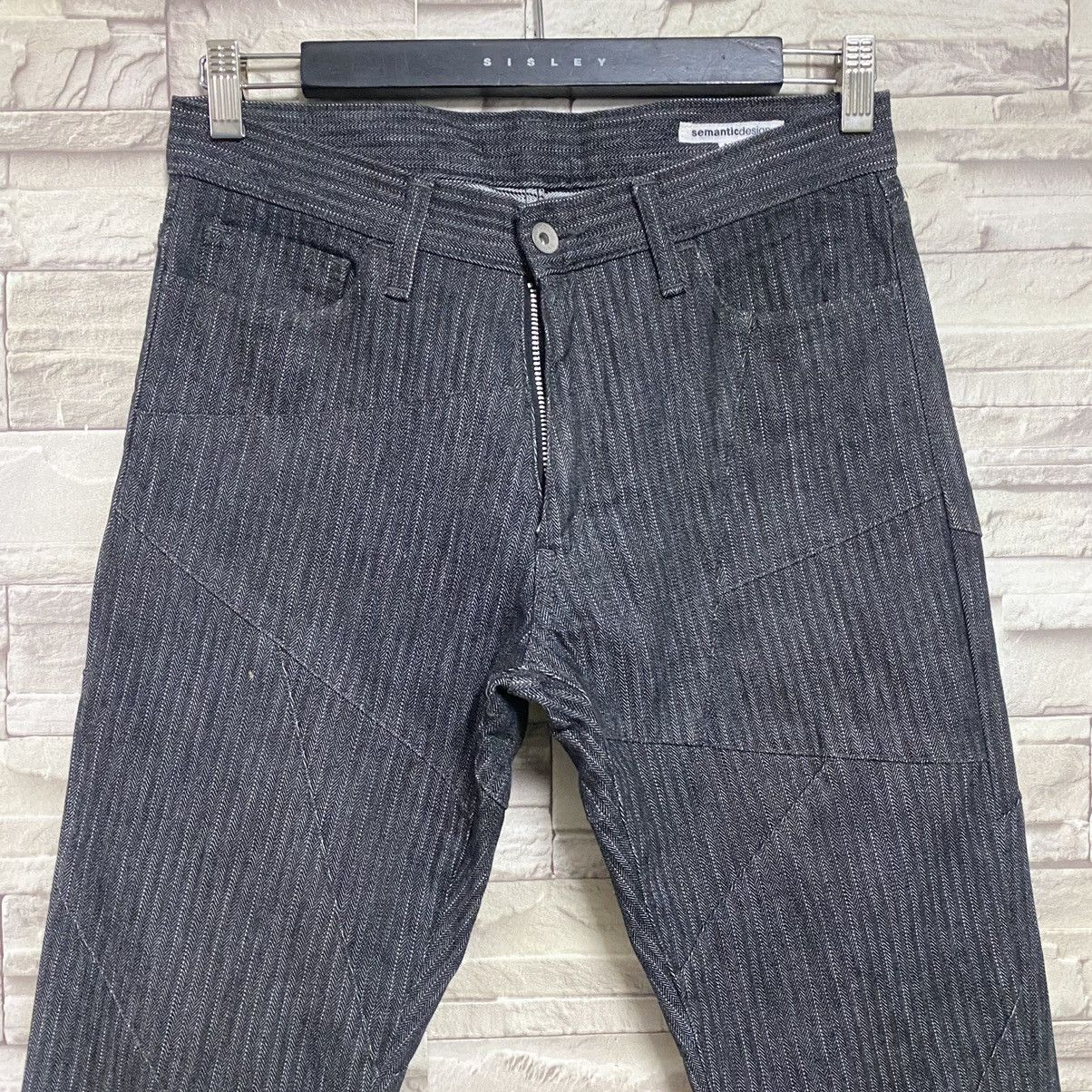 SEMANTIC DESIGN Reconstructed Denim Flare Jeans