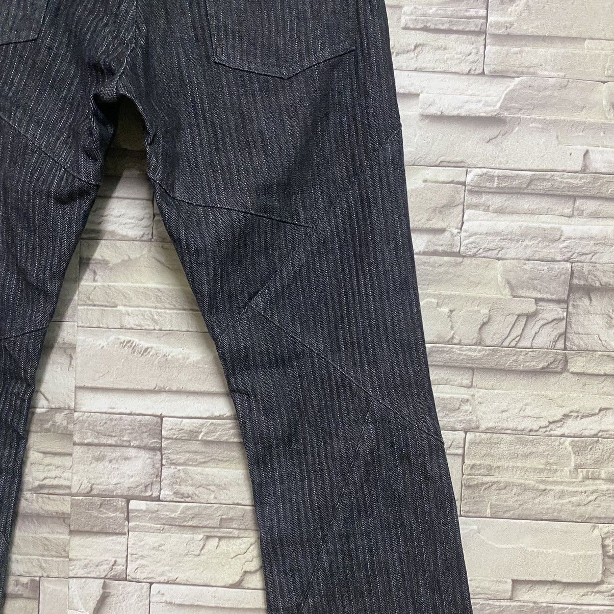 SEMANTIC DESIGN Reconstructed Denim Flare Jeans