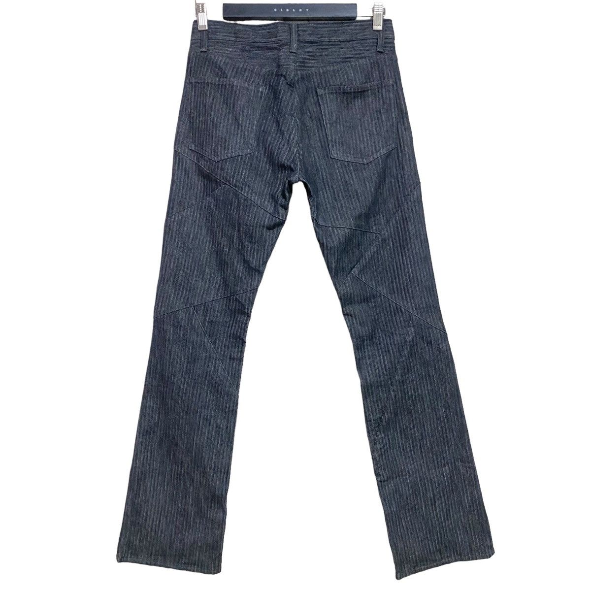 SEMANTIC DESIGN Reconstructed Denim Flare Jeans