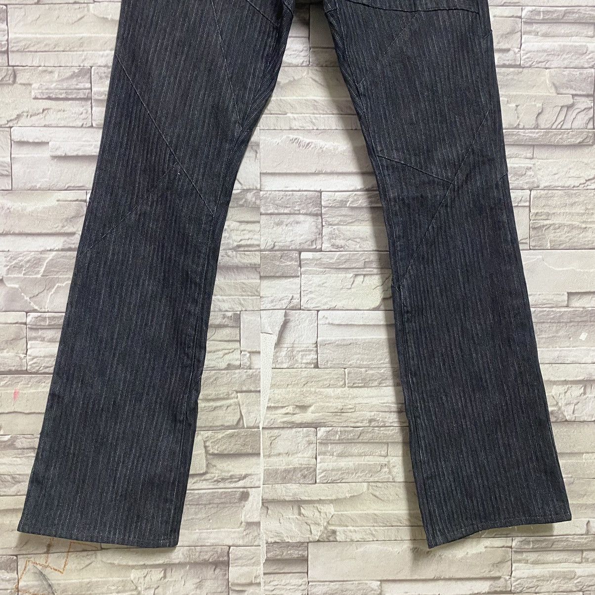 SEMANTIC DESIGN Reconstructed Denim Flare Jeans