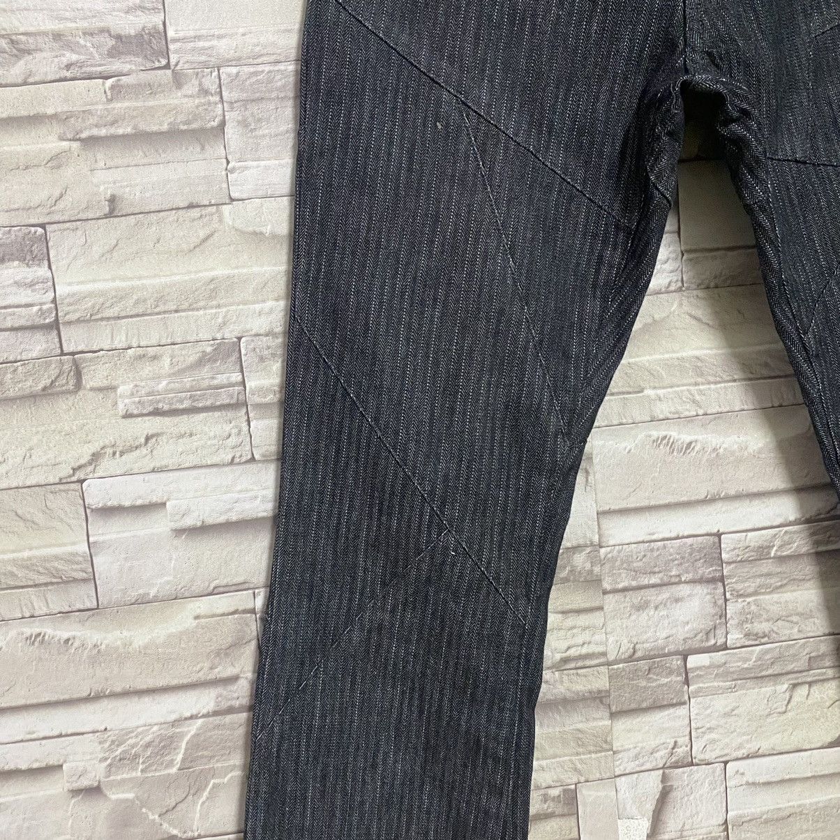 SEMANTIC DESIGN Reconstructed Denim Flare Jeans