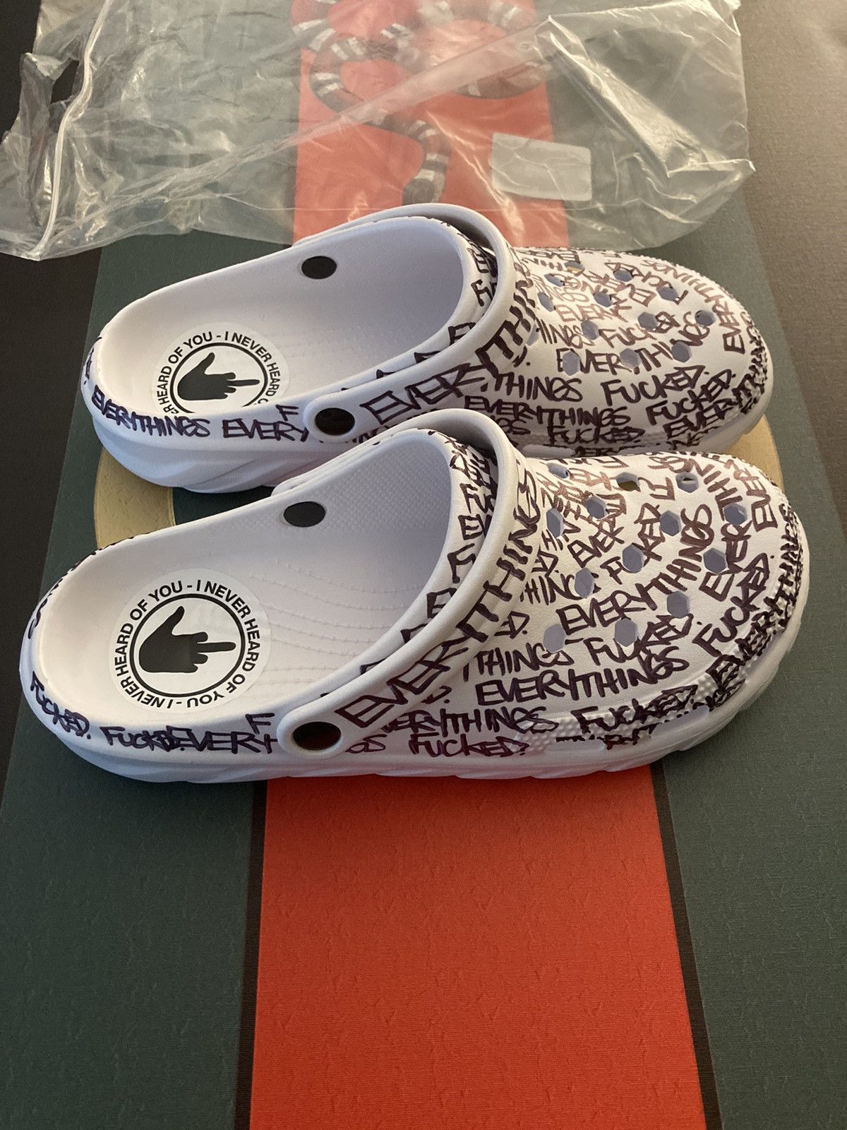 image of Ineverheardofyou Everything’S Fucked Crocs Ef Foam Slip On Shoes in White, Men's (Size 12)