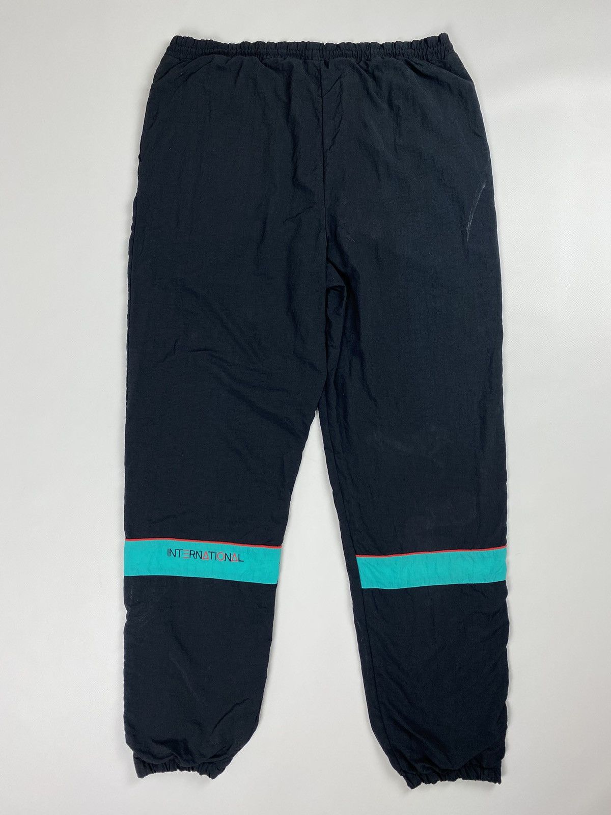 Puma × Vintage Puma International vintage men’s nylon track pants Size US 32 / EU 48 - 14 Thumbnail