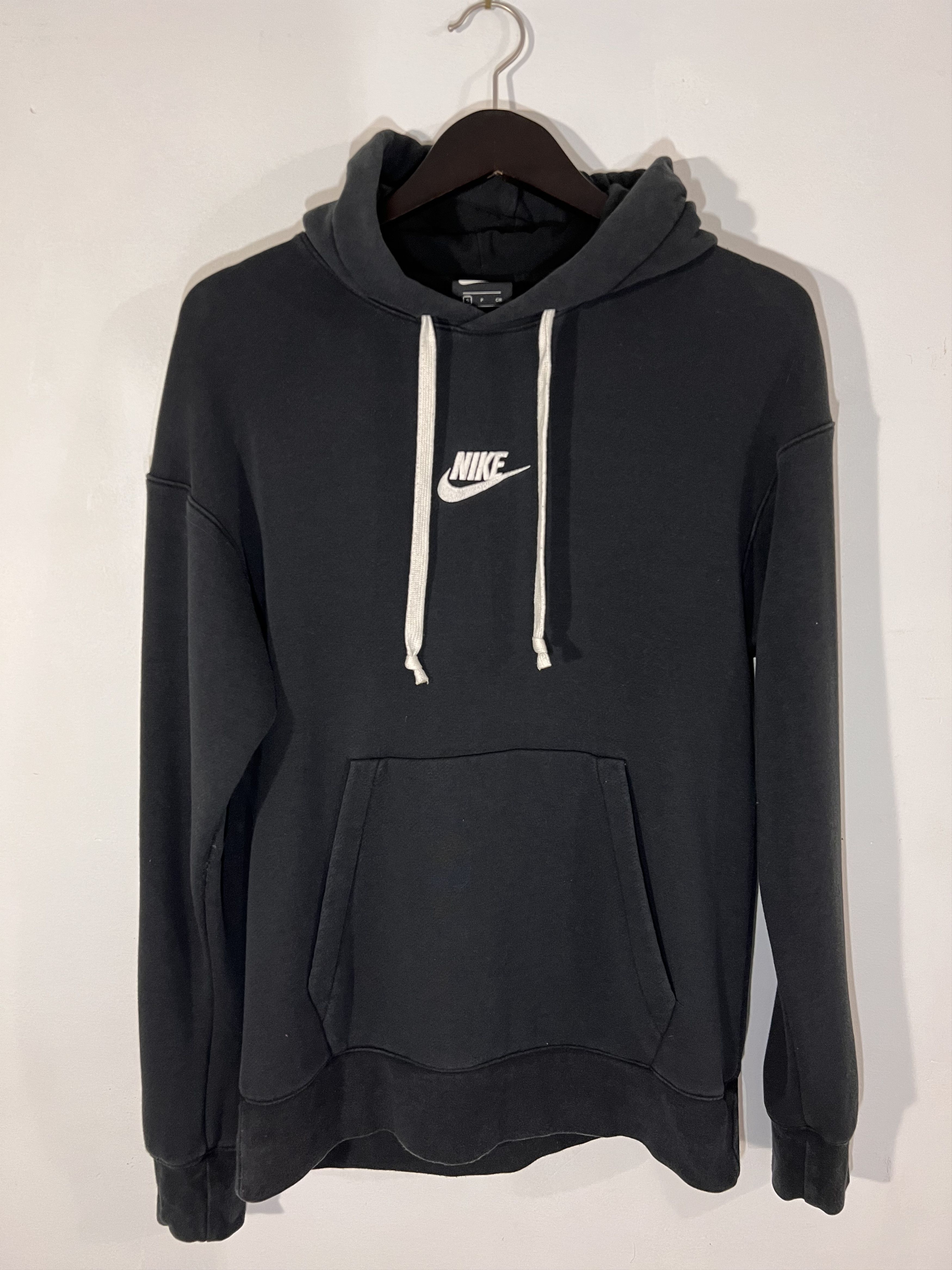 tan nike hoodie with black swoosh