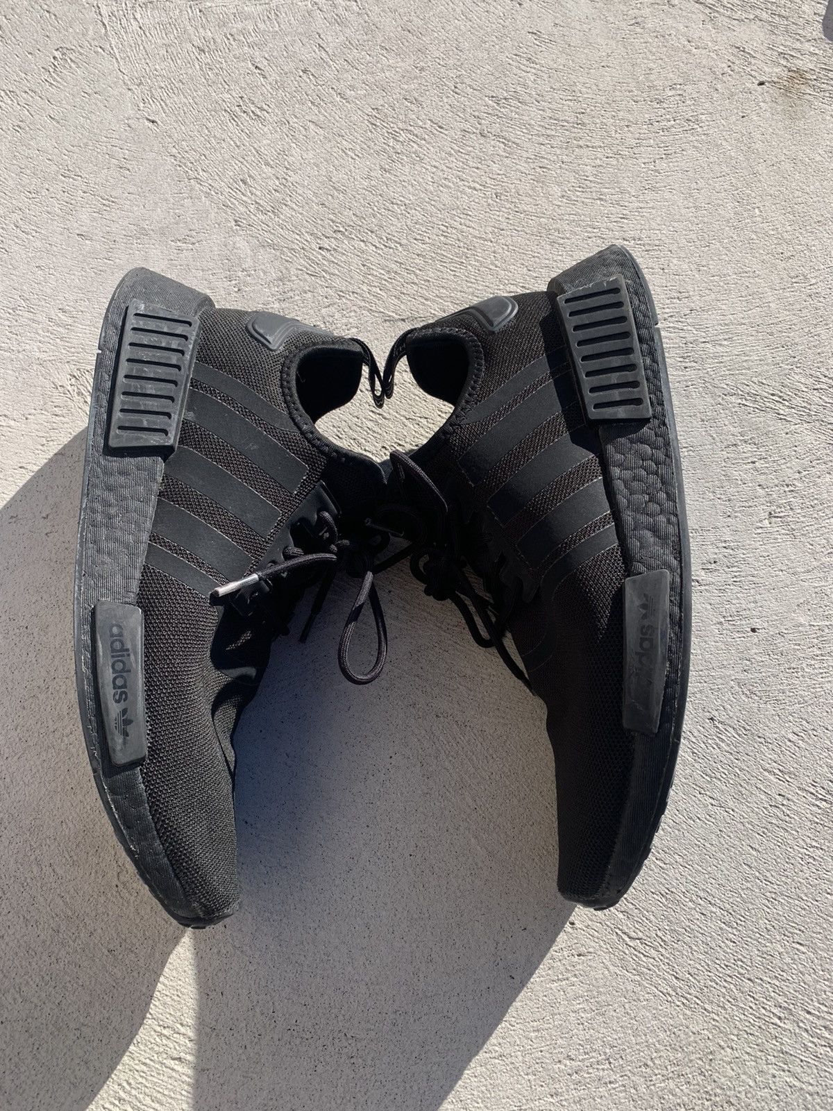 Adidas Triple Black NMD (9.5)