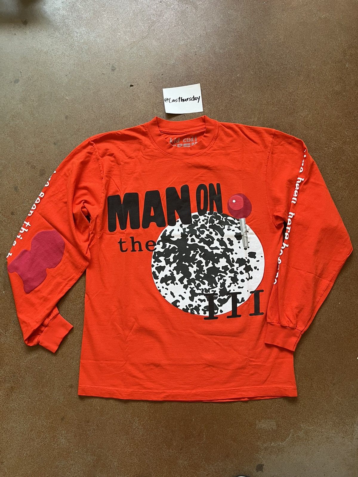 Kid Cudi Kid Cudi x CPFM MOTM III Return 2 Madness LS Orange