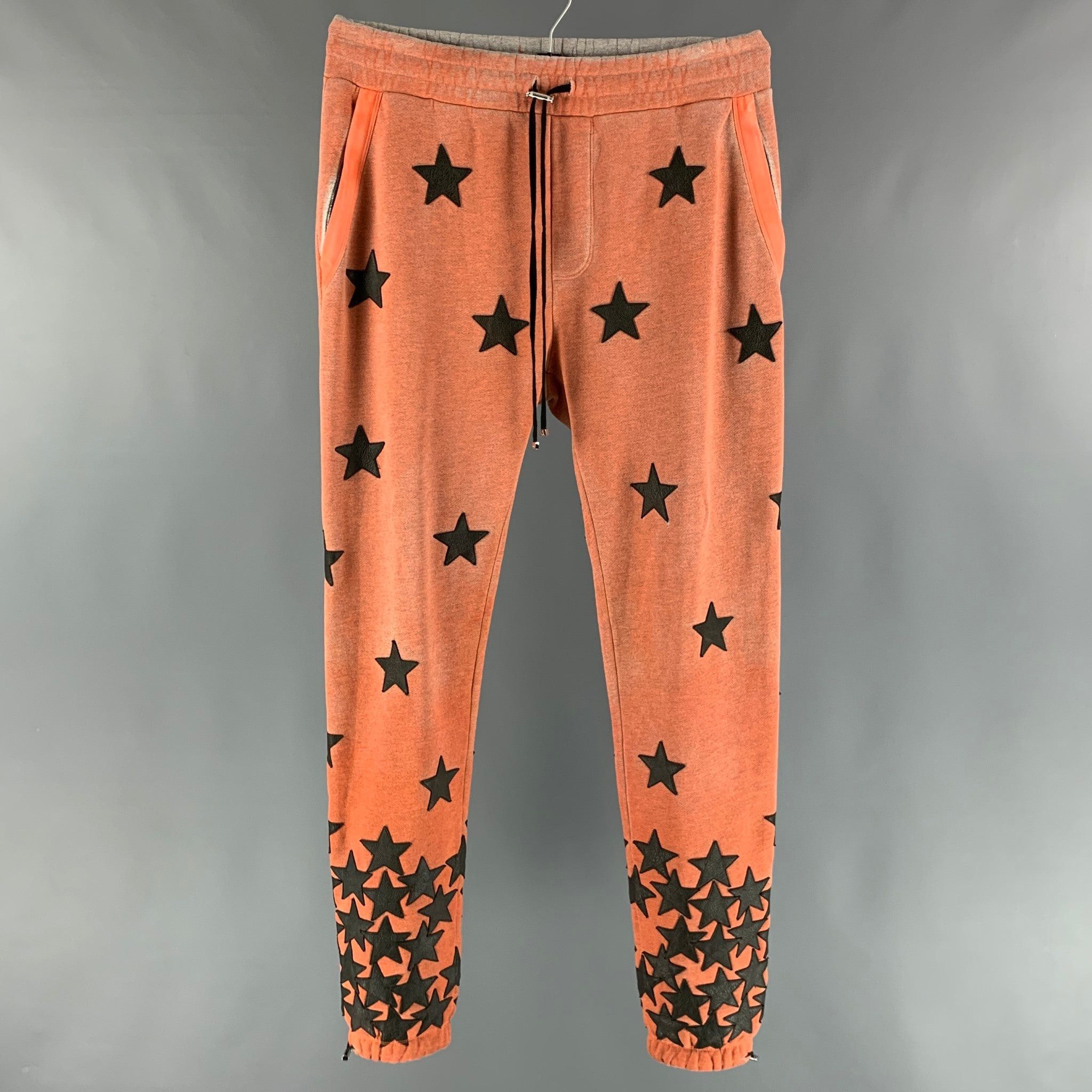 image of Amiri Orange Black Applique Stars Cotton Sweatpants Casual Pants, Men's (Size 36)