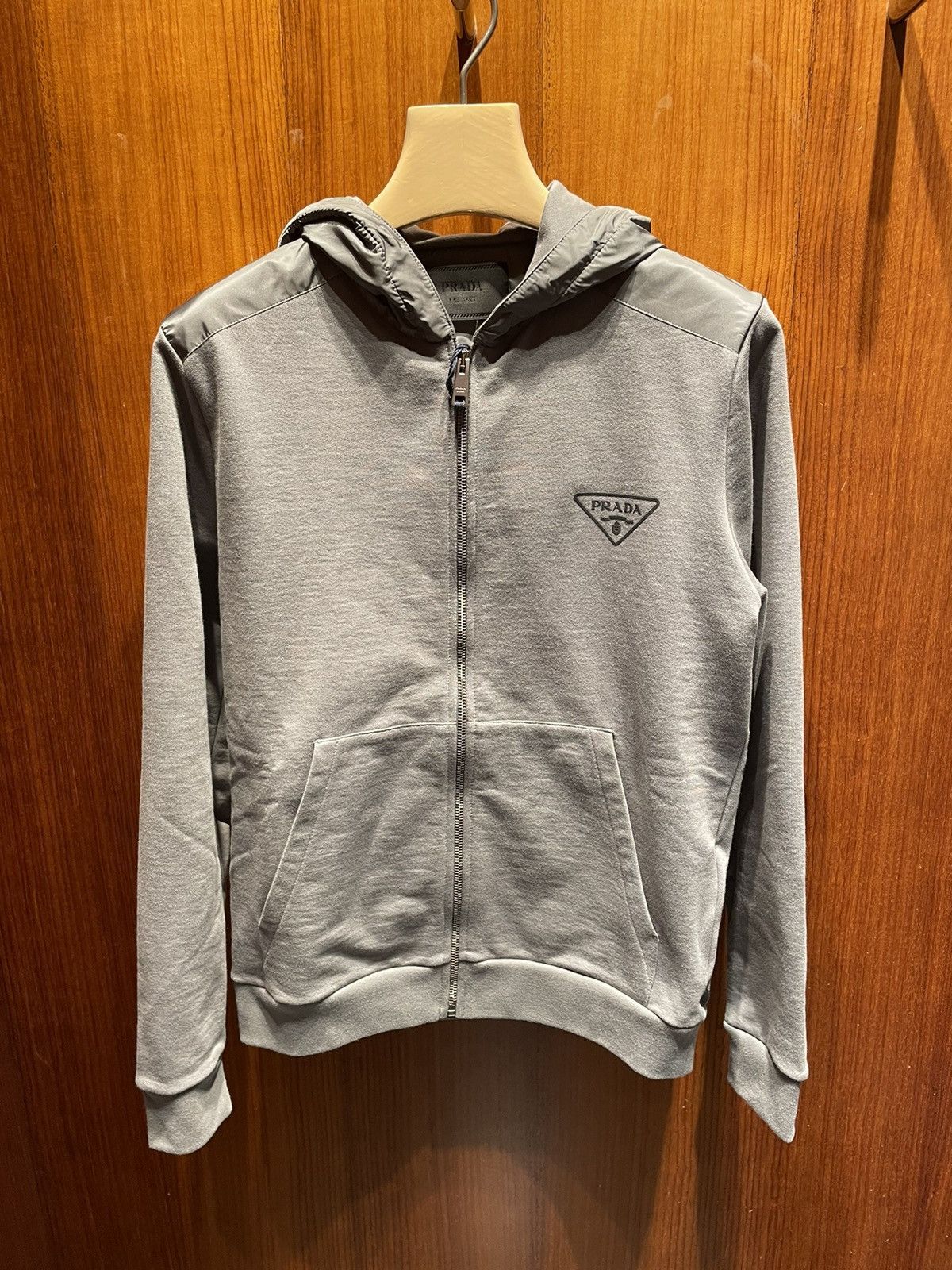 image of Prada Zip Up Chest Logo Hoodie in Grey, Men's (Size XL)