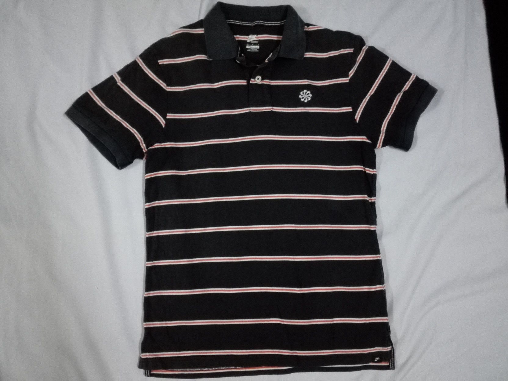 image of Nike Pinwheel Striped Polo Tee in Black, Men's (Size Small)