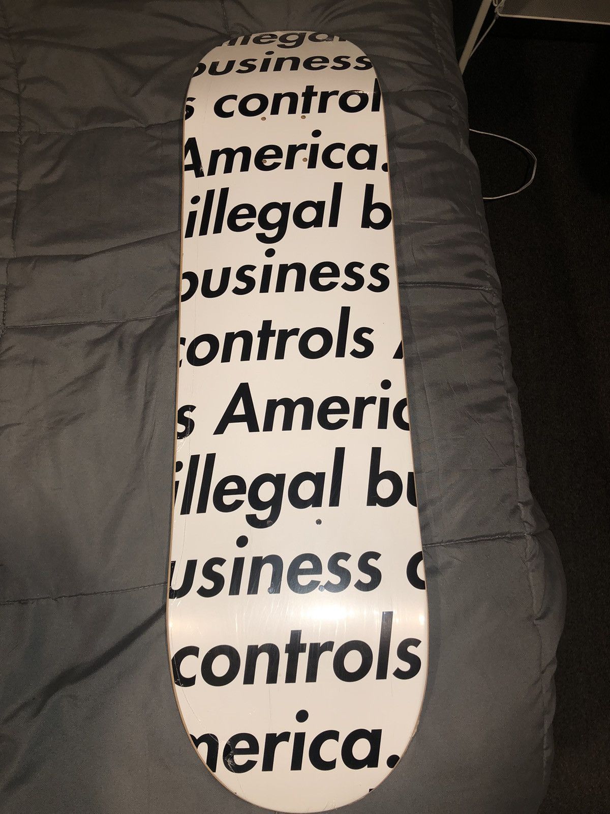 image of Supreme Illegal Business Skateboard in White, Men's