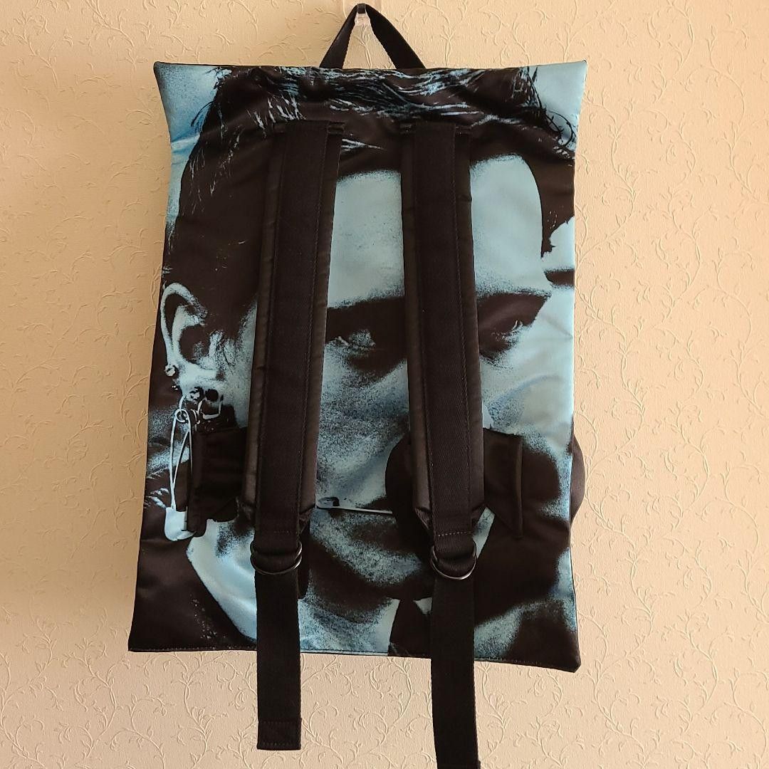 image of Raf Simons Goth Poster Backpack in Black, Men's