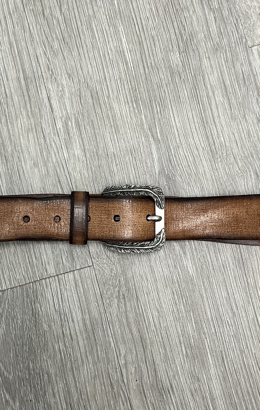 Feather buckle belt. 38