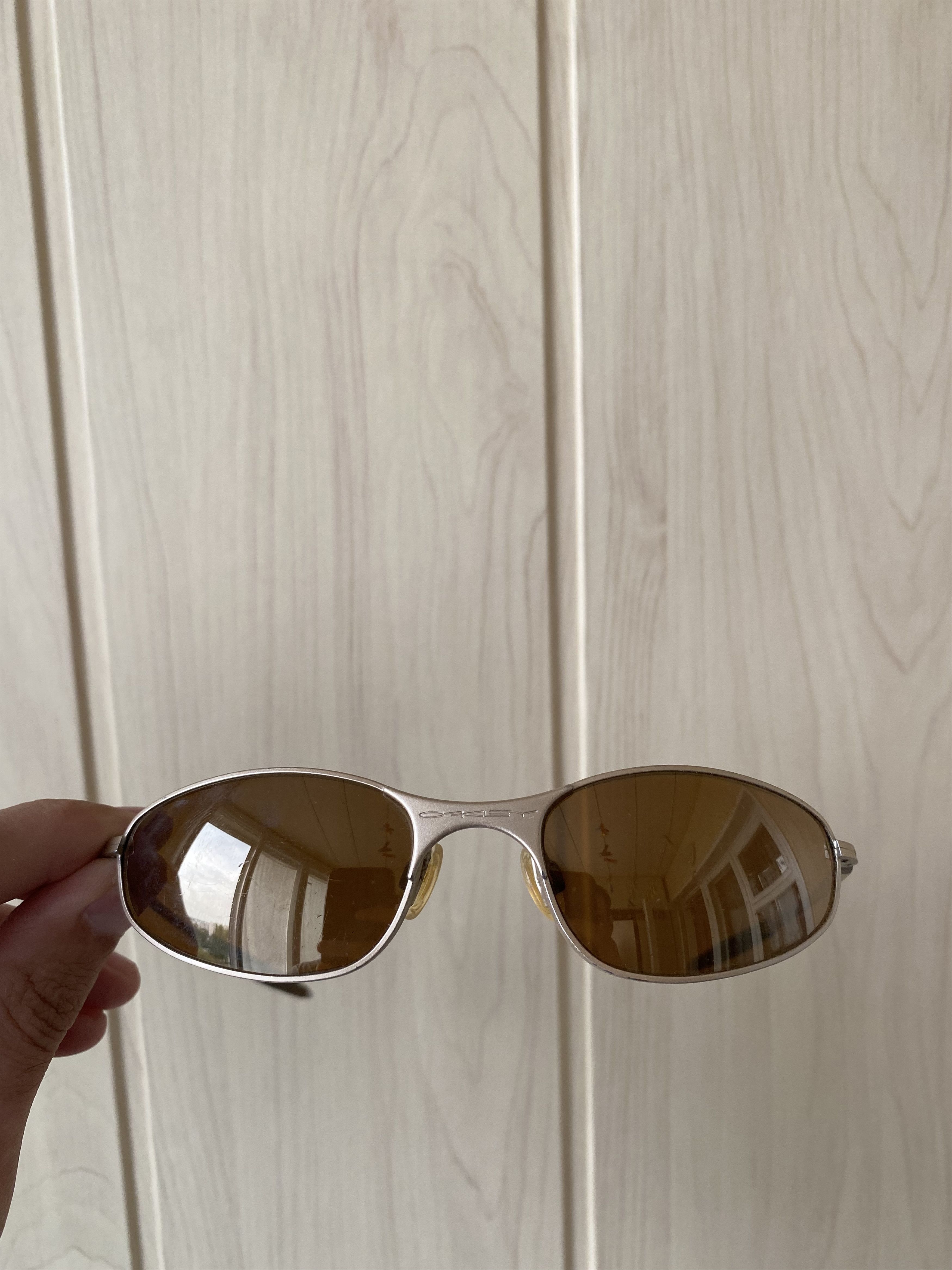 image of 90’S Oakley E Wire Titanium Sunglasses in Silver, Men's