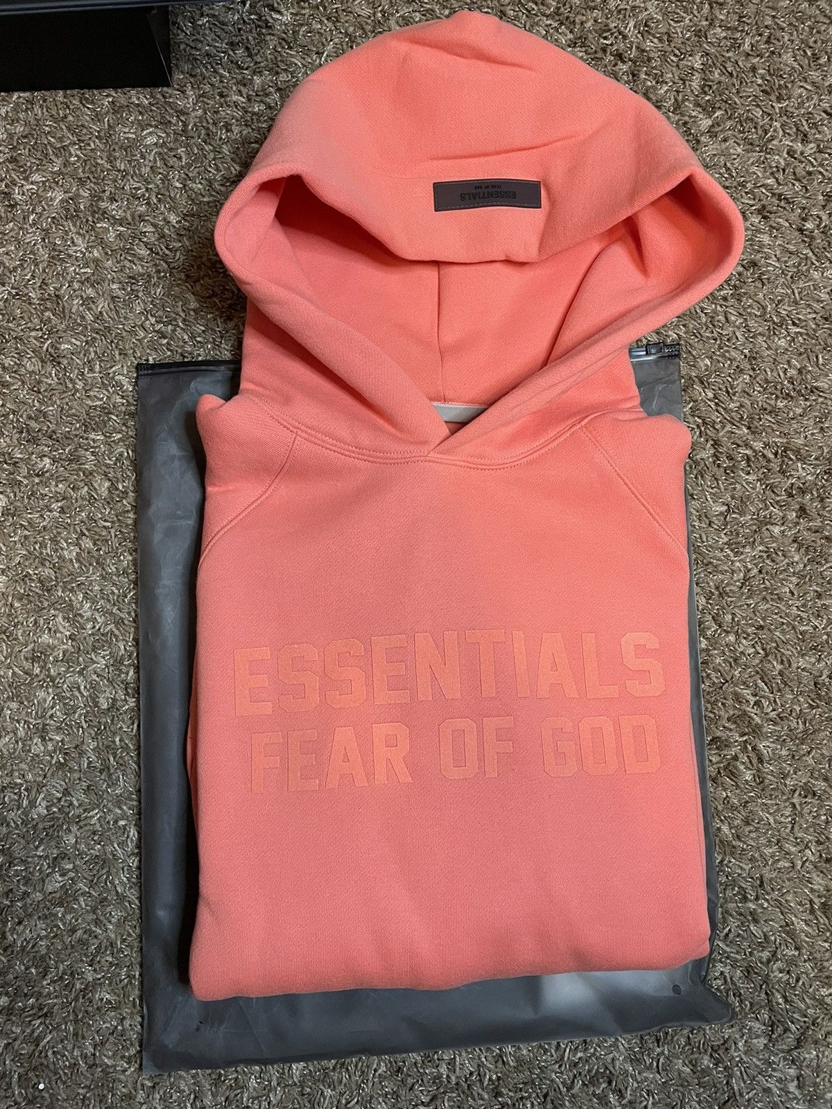 Fear of God Fear of God essentials hoodie coral size small Grailed