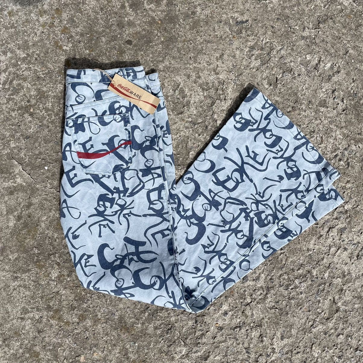 Coca Cola × Vintage Vintage Coca-Cola Jeans Multi-logo Crazy Fit Hype 00s New Size 34" / US 12 / IT 48 - 1 Thumbnail