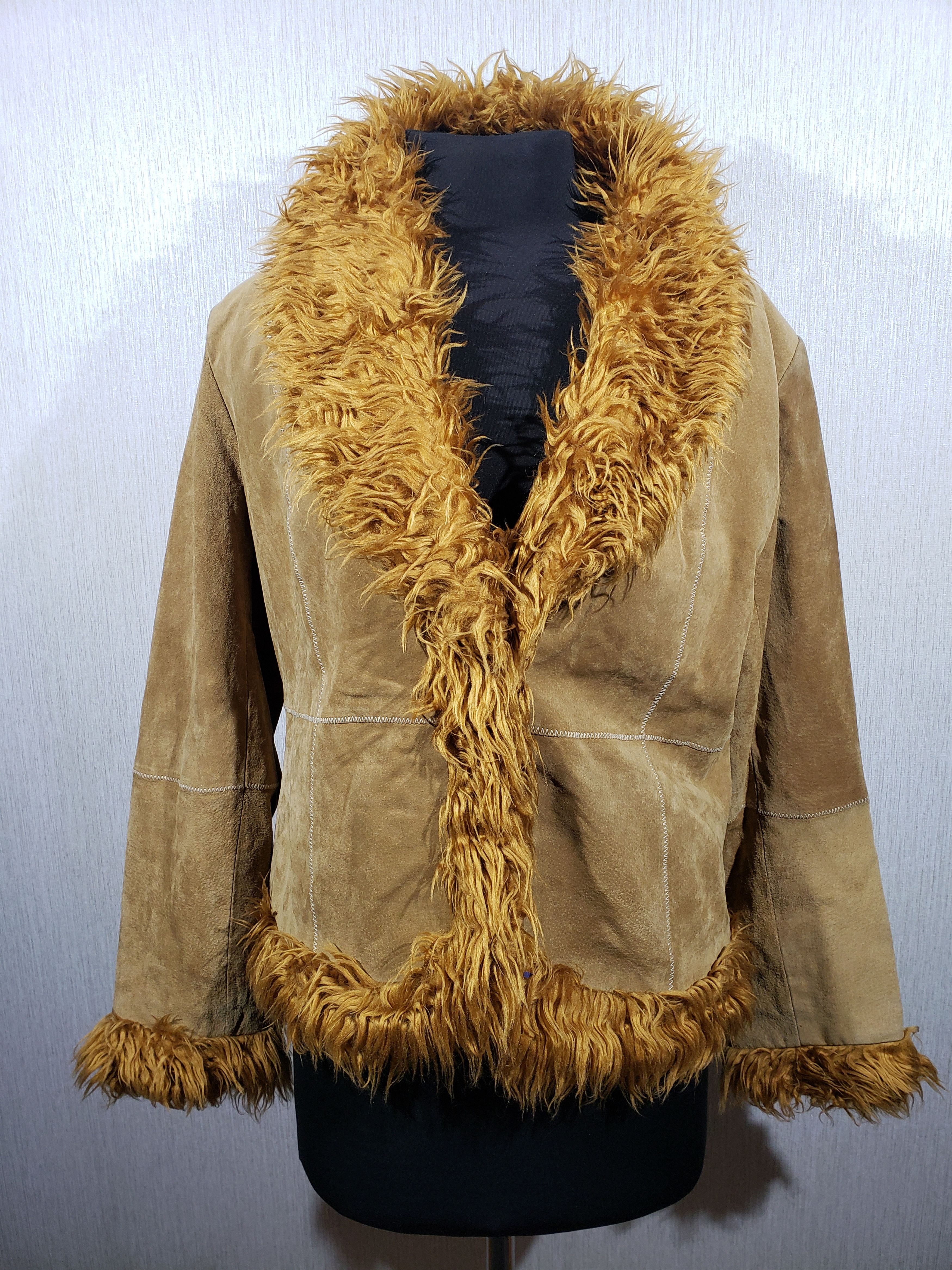 Women's suede jacket with a fluffy collar.