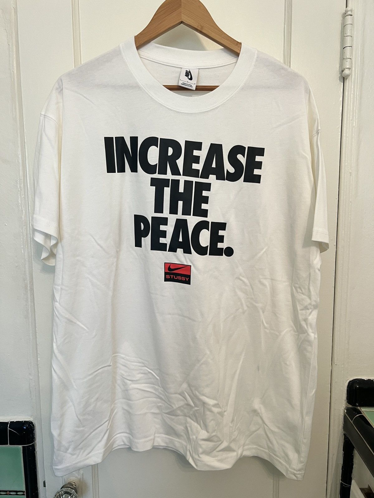 increase the peace stussy nike