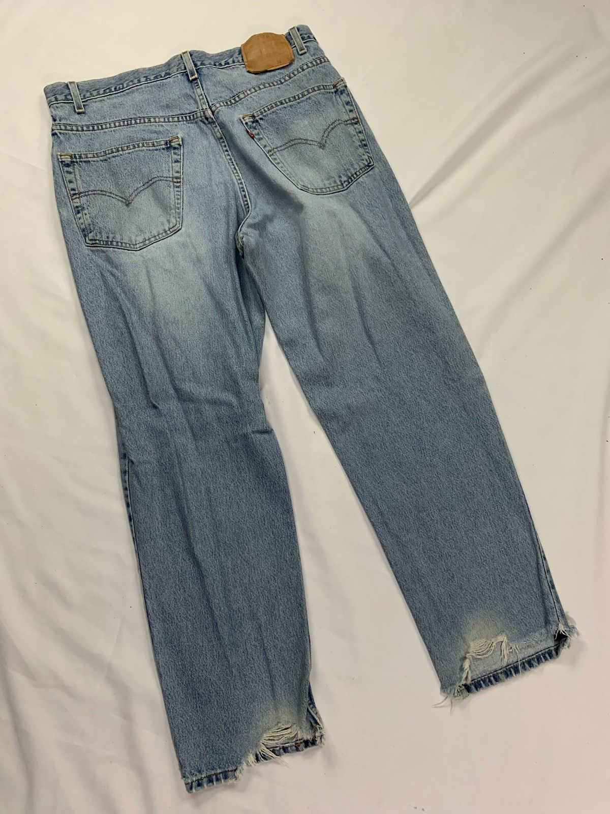 Vintage Levi’s 550 Light Wash Jeans Torn Cuffs 37x30