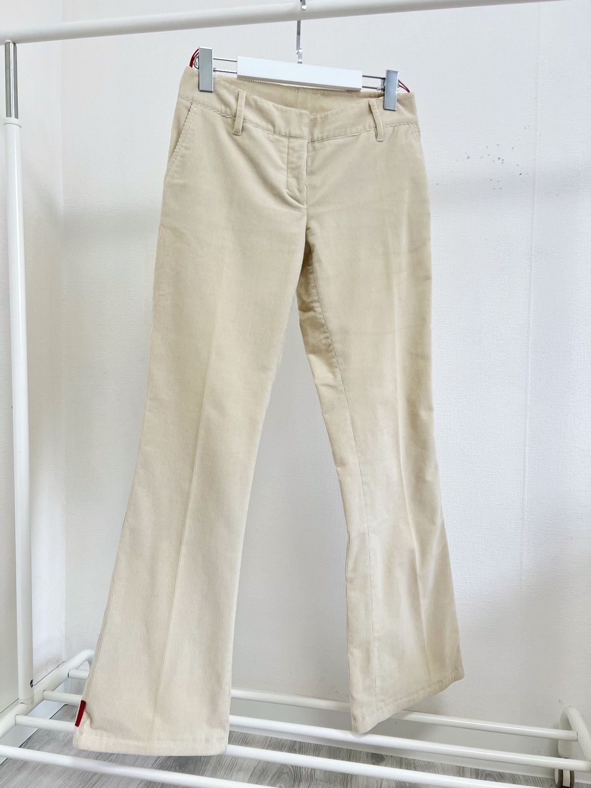 Image of Prada Flare Corduroy Red Tab Pants in Cream, Men's (Size 30)