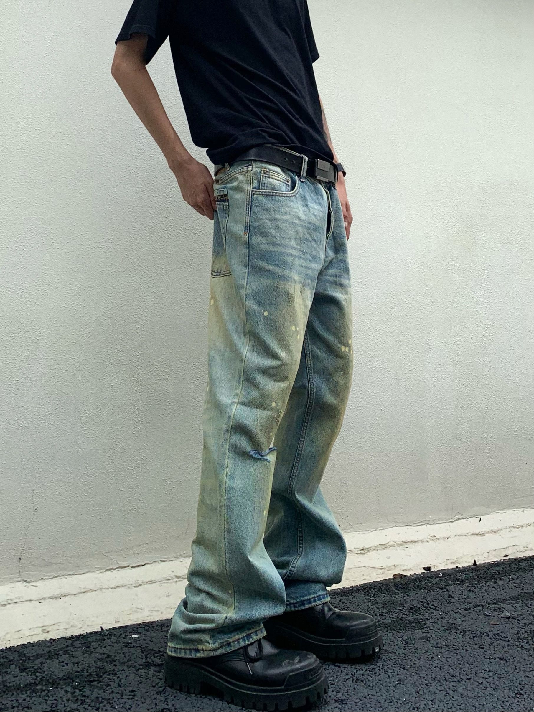 faded paint ripped flared jeans