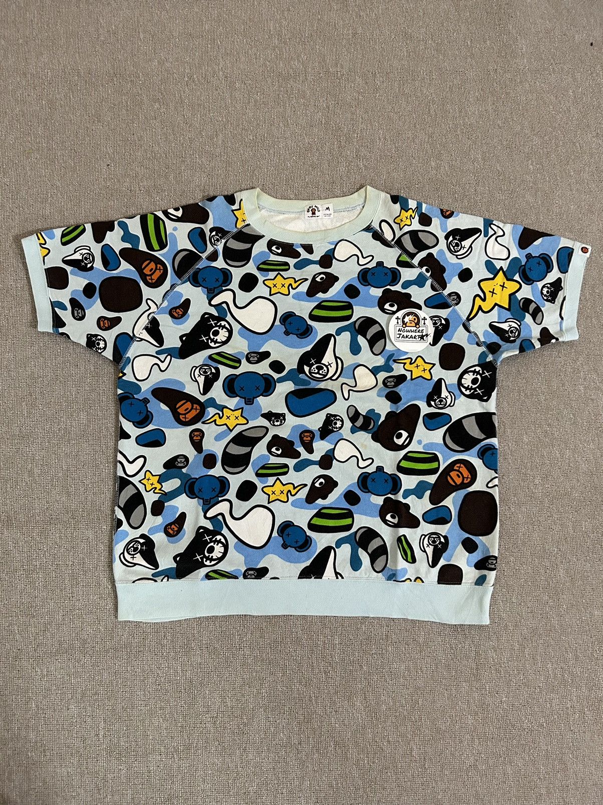 BAPE × KAWS Milo Animal Kingdom sweat varsity jacket A