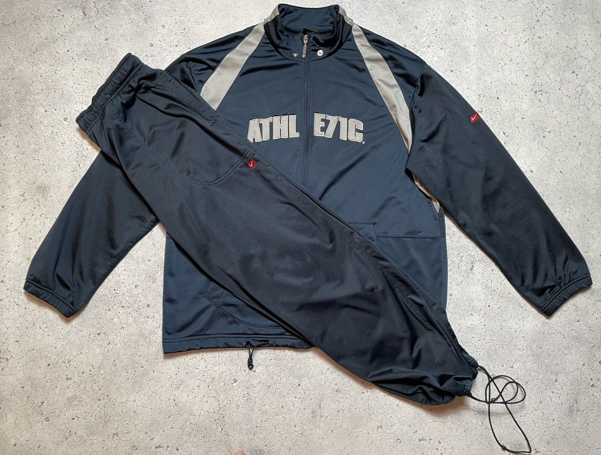 Nike large logo tracksuit deals