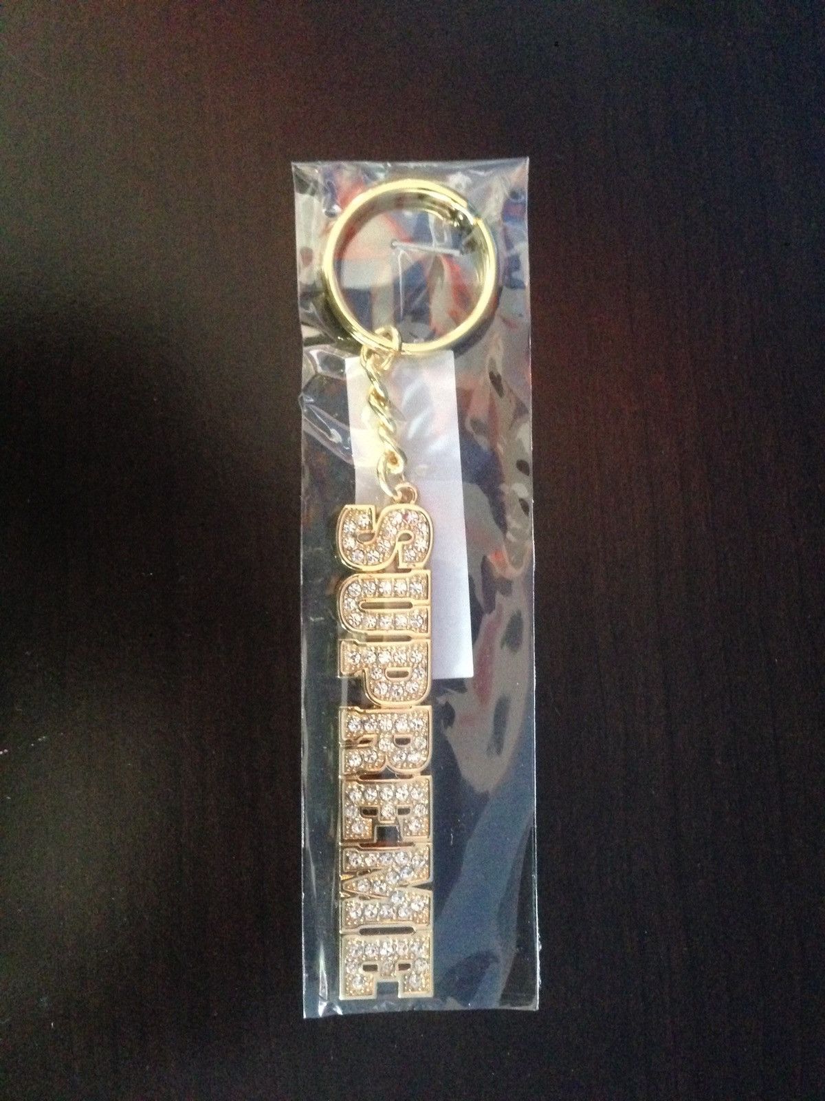 Supreme Supreme block logo keychain gold brand new | Grailed