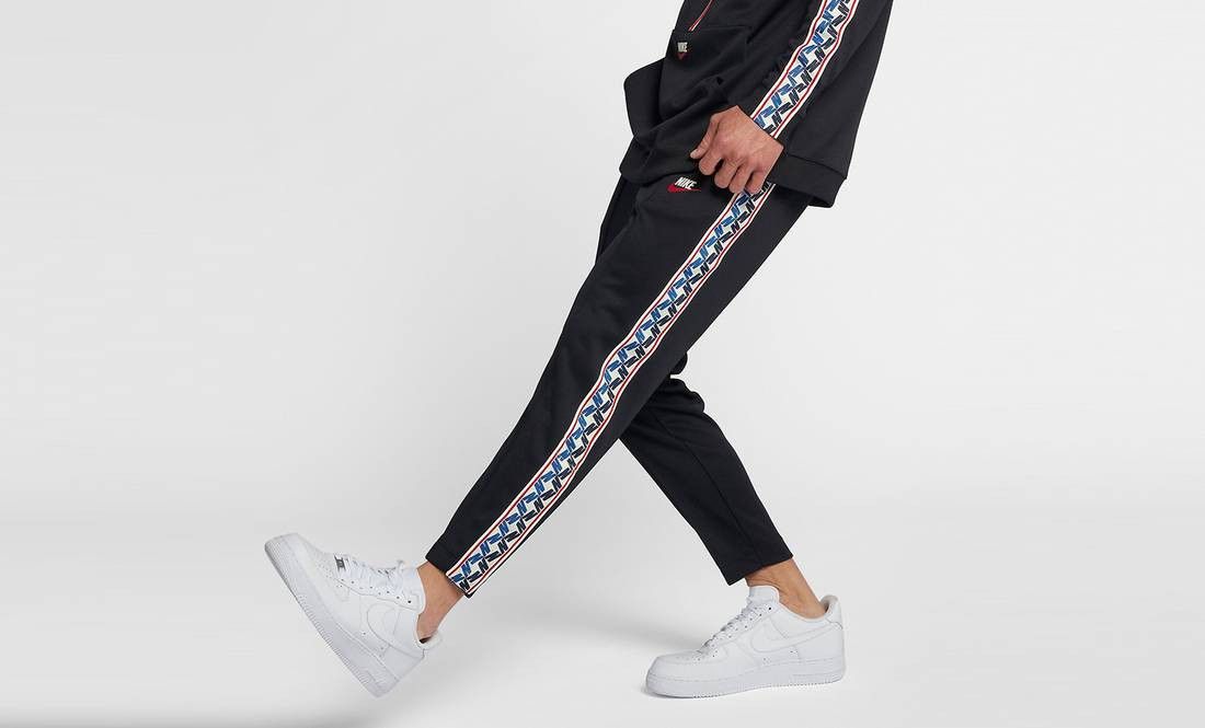 Nike taped hotsell poly track pants